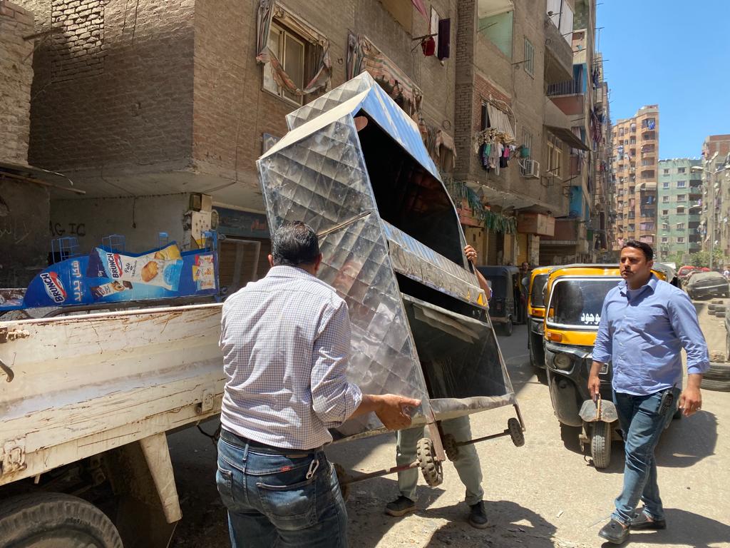 رفع ١٧٠٠ حالة اشغال للمحال والباعة الجائلين بشمال والطالبية والوراق والعياط والبدرشين